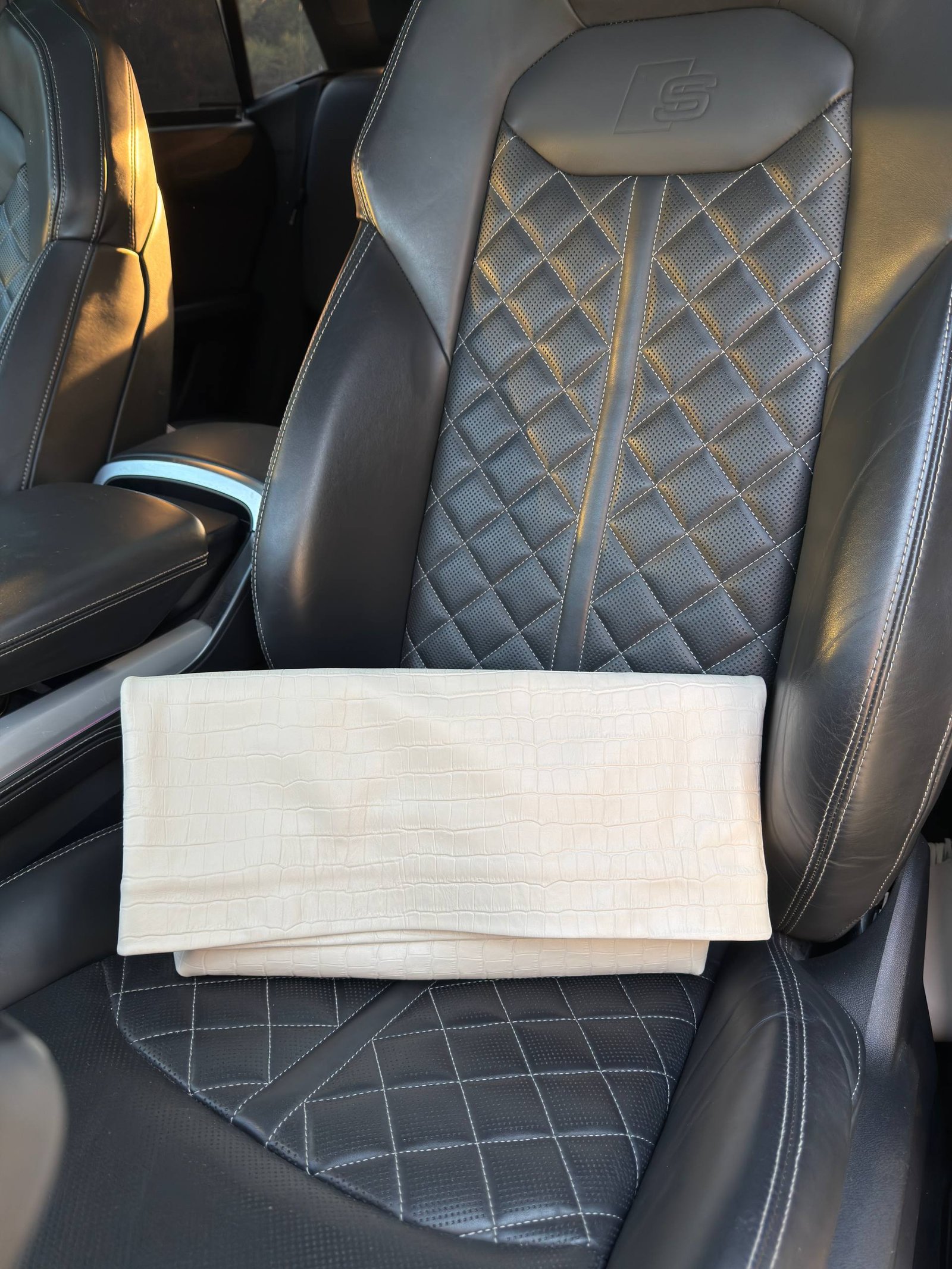 Structured milk leather clutch